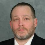 Jon M. Kreger Logo